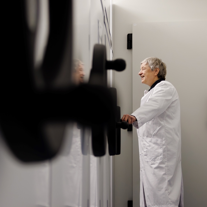Person in front of rolling cabinet in GMP storage area