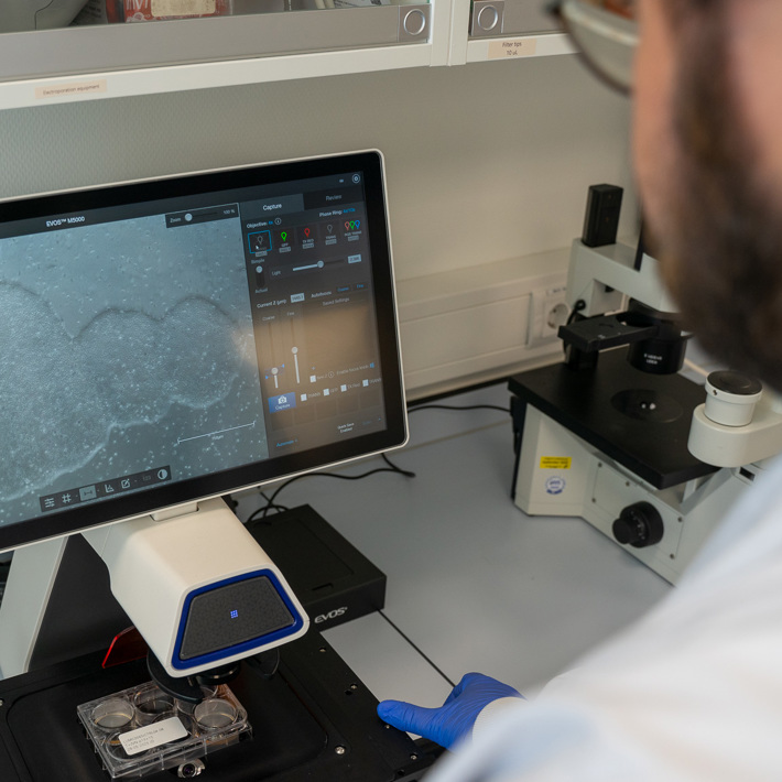 Researcher using hiPSC lab equipment